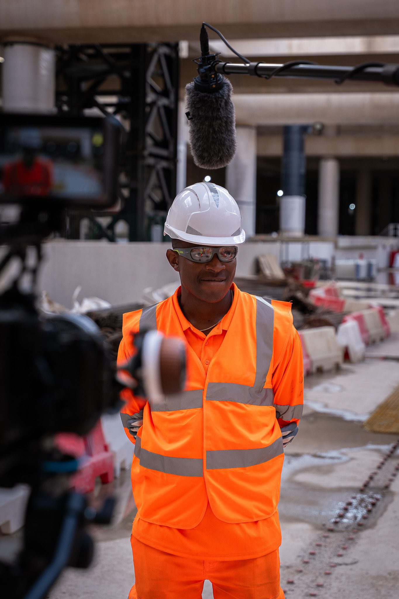 filming an interview on a building site