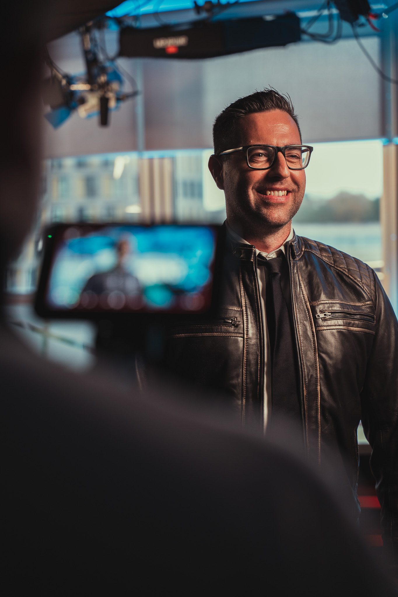 A happy client being interviewed on camera for a corporate training video