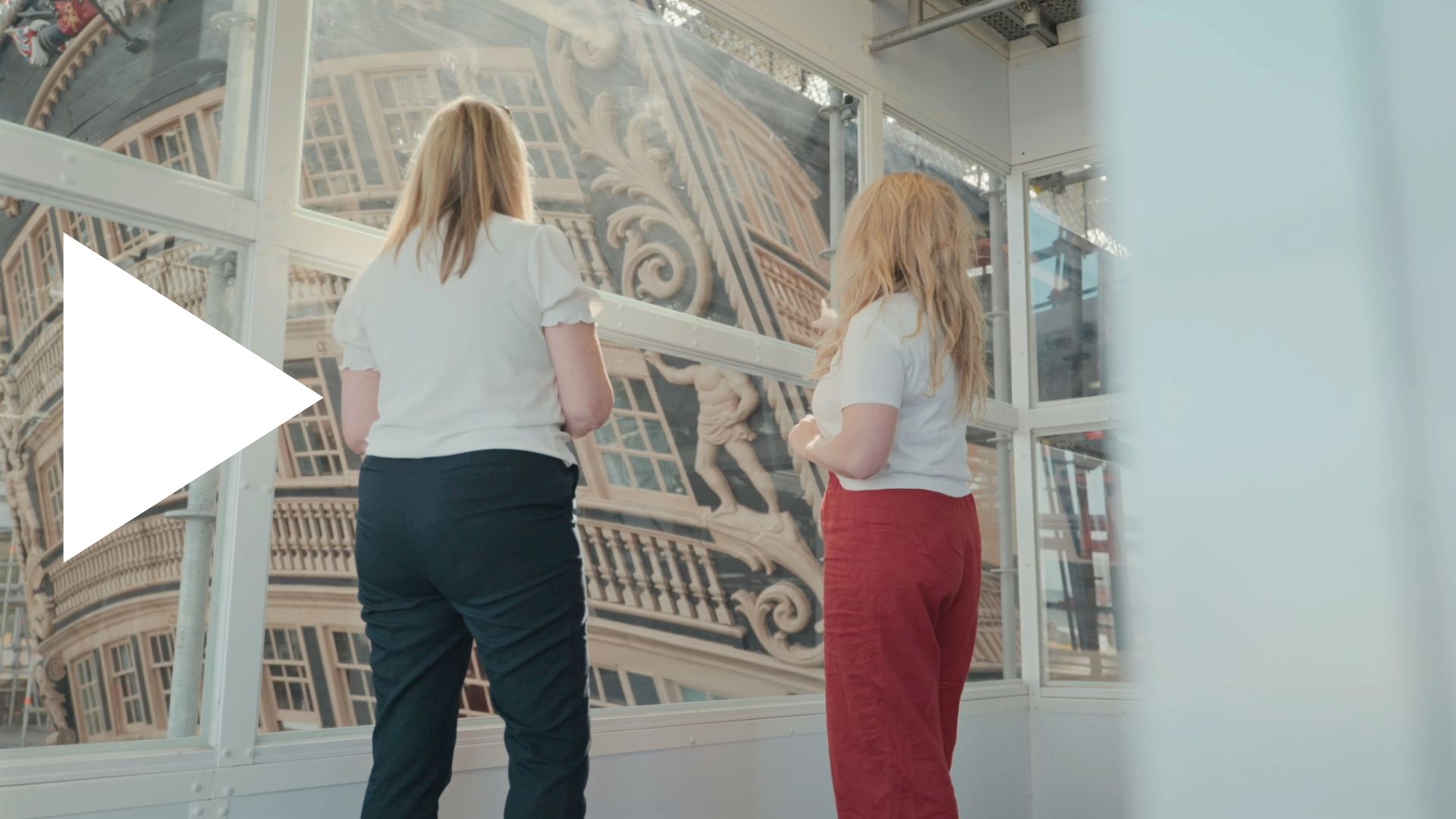 Two ladies standing on the HMS Victory LIVE walkway at the Portsmouth Historic Dockyard